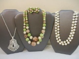 Three Vintage Necklaces including Trifari, Monet, and marbled beaded necklace and clip-on earring