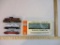 Four HO Scale Train Cars including Rock Island Diesel Locomotive/Switcher 415, Lionel Seaboard