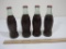 Four Vintage Glass Coca-Cola Bottles Marked Chicago Illinois, Omaha Nebraska, Marque Maine and