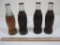 Four Vintage Glass Coca-Cola Bottles Marked Portland Maine, Erie Pennsylvania, Lexington Kentucky
