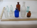 Nine Assorted Glass Medicine Bottles