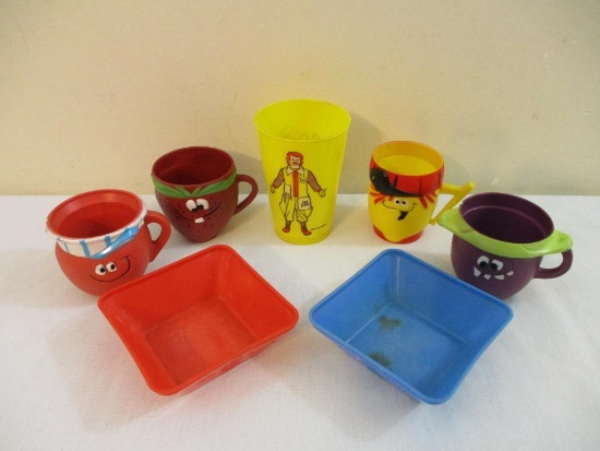 Vintage Children's Plastic Dishes including Kool-Aid Mugs, Cap'n Crunch Bowls, and McDonalds Cup,
