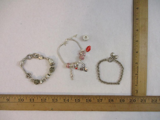 Three Silver Tone Bracelets including Avon consultant charm bracelet, heart charm and more, 3 oz