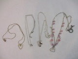 Four Necklaces and Pendants featuring hearts, mitten, and wishbone, 2 oz