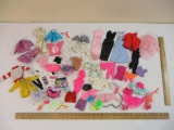 Assorted Barbie and Doll Clothes including some licensed Barbie pieces, see pictures, 1 lb