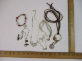 Assorted Jewelry Items including Disney Angel Necklace, heart pendants, and more, 4 oz