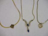 Three Gold Tone Necklaces including rhinestone heart pendant and more, 1 oz