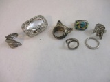 Seven Unique Silver Tone Rings including frog face, feather wrap and more, 3 oz