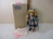 Marian Yu Girl in Blue Plaid Coat with Teddy Bear Porcelain Doll with Stand, in original box with