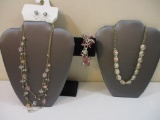 Three Pink and Silver Tone Jewelry Items including beaded necklace and earring set, bracelet and