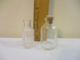 Two Vintage Clear Glass Miniature Bottles: WT Co (USA) and TCW Co USA 4 with stopper, 2 oz