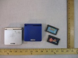 Two Nintendo Game Boy Advance SP Game Systems with Kirby Nightmare in Dream Land and Yoshi's Island