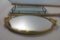 Two Mirrored Dresser Trays. Gold trim oval and rectangular with railing (some small chips)