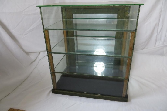 Table Top Glass Showcase with mirrored back and 3 glass shelves. 19" tall, 16 3/4, x 11 3/4 deep