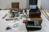 Metal File Box, variety of pens, calculator, staplers, manual typewriter brushes, mechancial drawing