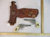 Pair of Matching Hubley Cap Guns with Dual Leather Holster, 1 lb 4 oz