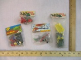 Four Sealed Vintage Military Toys including tank, helicopter, Jeep, and artillery wagon, made in