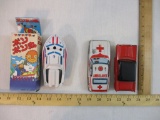 Three Vintage Tin Litho Toys including 1960s Ambulance, Pop Pop Boat in original box, and red car,