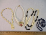 Four Necklaces including blue glass beads and more