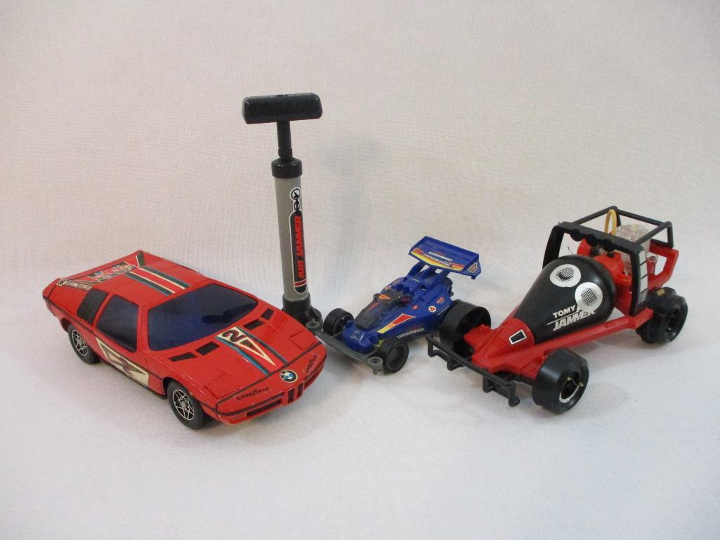 Three Toy Race Cars including Tomy Air Jammer Proxibid