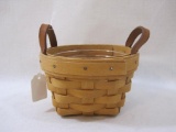 Small Round Longaberger Basket with leather handles and plastic liner, 3 oz