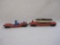 Two Vintage Lionel Train Cars including Red Flat Car with boat load and Turbo Missile Launching Car,