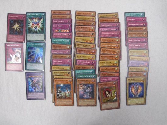 Assorted Yu-Gi-Oh Trading Cards including foil Shadow Spell, 1st edition foil Reptilianne Rage, 1st