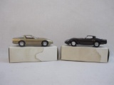 Two 1980s Chevrolet Corvette Promo Model Cars: 1982 Dark Claret Corvette and 1986 Bronze Corvette,