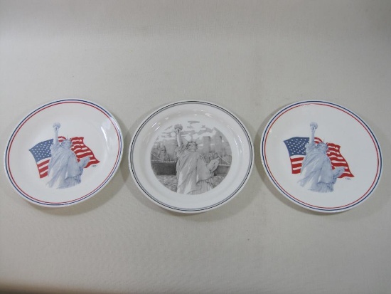 Three Corelle Statue of Liberty Dinner Plates, Two 1991 with Flag, One with Twin Towers, 10.75 inch