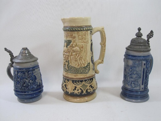Two German Beer Steins with Tops with a Pitcher