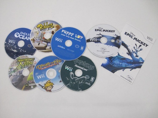 7 Nintendo Wii Games including Endless Ocean, Disney Epic Mickey (with booklet), Puppy Luv: Your New