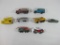 Seven Die Cast Vehicles by Matchbox and Hot Wheels, Including Construction Vehicles, a Bus, Land