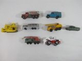 Seven Die Cast Vehicles by Matchbox and Hot Wheels, Including Construction Vehicles, a Bus, Land