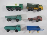 Six Die Cast Trucks by Lesney and Matchbox, Including a BP Tanker Truck, Mercedes, a Hay Trailer and