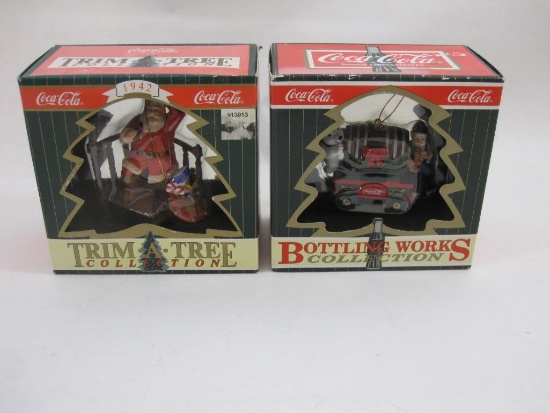Two Coca-Cola Christmas Ornaments, in original boxes, 1 lb