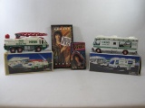 Two Hess Trucks includes Recreation Van, 1998, Emergency Ladder Truck, 1996, Plus Howard Stern U.S.