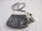 New B Makowsky Metallic Pewter Leather Zip Top Crossbody Bag with Chain Detail and branded storage