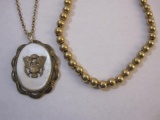 Two Gold Tone Necklaces including mother of pearl locket and gold plated ball chain