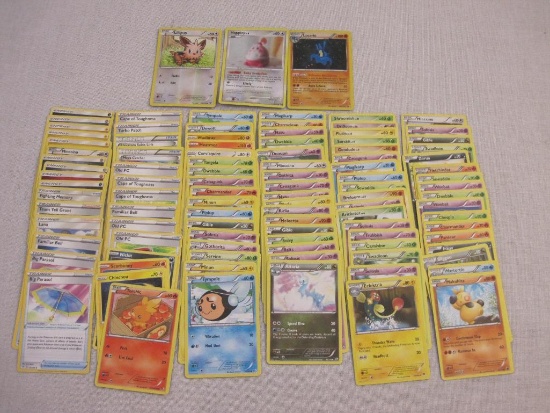 Assorted Pokemon Trading Cards including foil Lucario, Happiny, Torchic, Lillipup Minccino and more,