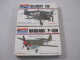 Two Monogram 1/72 Scale Plastic Model Kits: Bearcat F8F 6789 and Warhawk P-40N 6792, unassembled in