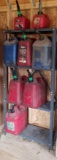 Plastic Shelf with Assorted Gas and Kerosene Jugs