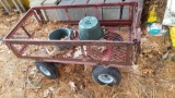 Red Four Wheeled Cart with Handle and Flip Down Sides