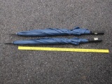 Two Large Blue Umbrellas