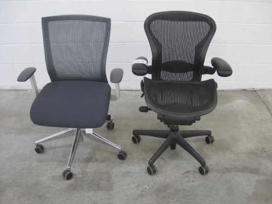 Two Ergonomically Designed Office Chairs with Castor Wheels and Adjustable Height, By Herman Miller