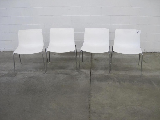 Four Plastic White Chairs with Metal Legs
