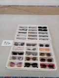 Two Plastic Trays of Styled Sunglasses and Readers
