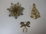 Three Vintage Gold Tone Pins including Christmas Tree, Filigree Flower and more, 2 oz