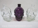 Three Glass Skull Bottles