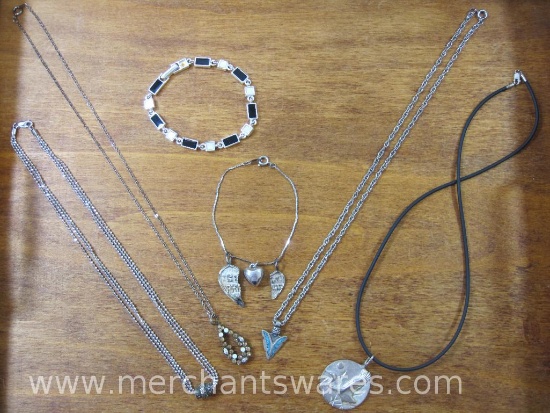 Four Silver Tone Necklaces and Two Silver Tone Bracelets