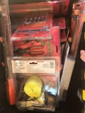 Black and yellow crate with numerous new screwdriver sets and bungee cord sets